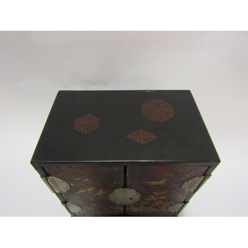 4279 - A table top lacquered jewellery chest twin doors over painted with  birds in landscape (no key)