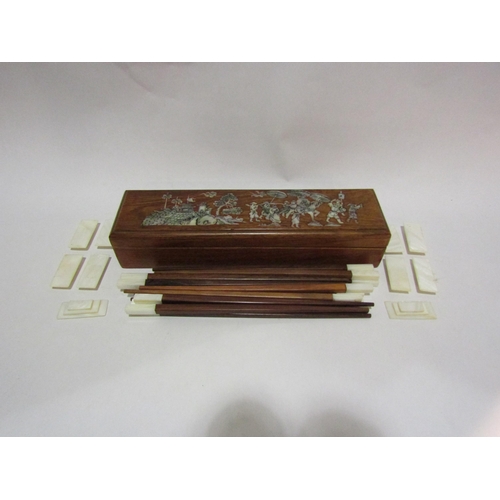 4280 - A Chinese hardwood box with mother-of-pearl decoration containing chopsticks and rests