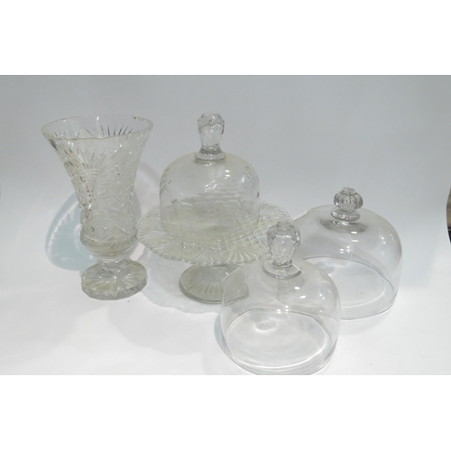 4414 - Three glass domes, various sizes, a moulded glass tazza and a cut glass vase (5)