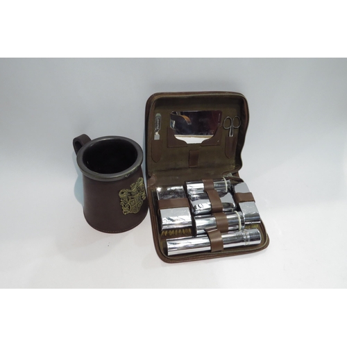 4437 - A chromium plated vanity case set and a cased tankard