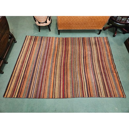 4463 - A John Lewis hand made multi-coloured, rich stripe design rug, 240cm x 170cm (a/f with large stain t... 