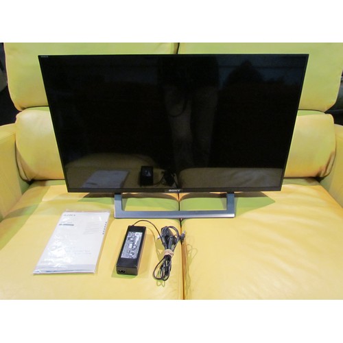 1076 - A Sony KDL-32WD756 television with power supply and instructions