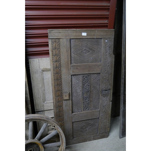 2114 - An 18th Century carved oak cofferfront and an oak panel, a/f