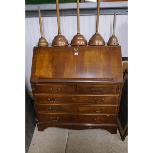 2120 - A reproduction mahogany bureau, fall front over drawers, bracket feet