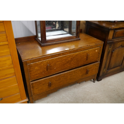 2152 - A 1940's chest of drawers, two drawers, galliered back, castors     (R) £20