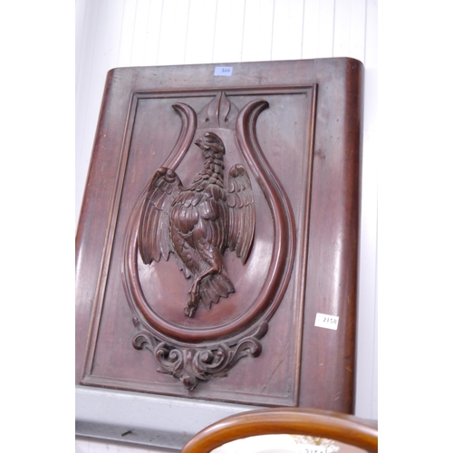 2158 - A pair of Victorian mahogany doors, bird detail carved in high relief applied sheild, 75cm tall