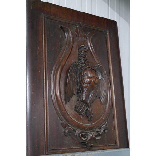 2158 - A pair of Victorian mahogany doors, bird detail carved in high relief applied sheild, 75cm tall