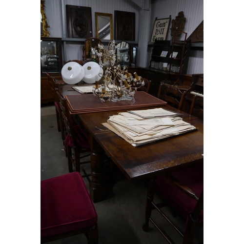 2185 - A country oak extending leaf dining table in the refectory style, heavy turned legs 294 x 99cm exten... 