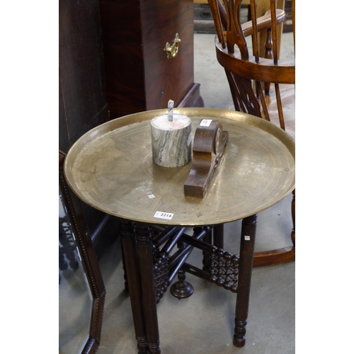 2216 - An Eastern brass top folding table 58cms     (E) £20-30