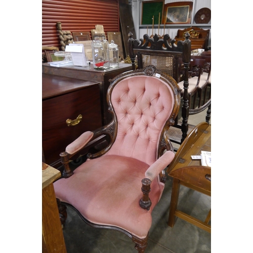 2220 - A Victorian carved walnut open armchair