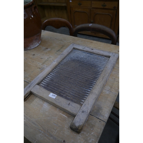 2297 - A rustic timber washboard with a metal centre.