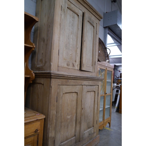 2334 - A Victorian pitch pine four door housekeepers cupboard in two sections 130w x 53d x 248cm tall