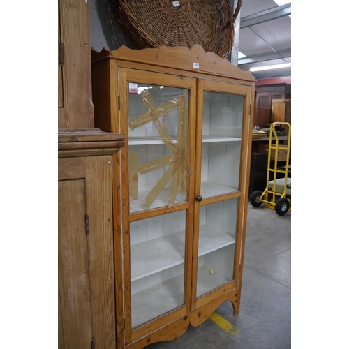 2335 - A Victorian pine and glazed two door cupboard, one payne a/f