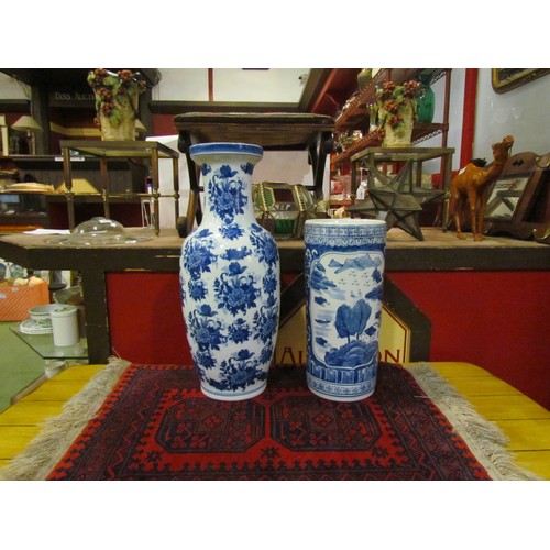4020 - A Chinese blue and white umbrella and stick stand, 43cm tall, and a floor vase, 60cm tall (2)