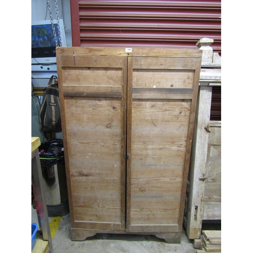 2083 - A rustic two door pine cupboard     (R) £30