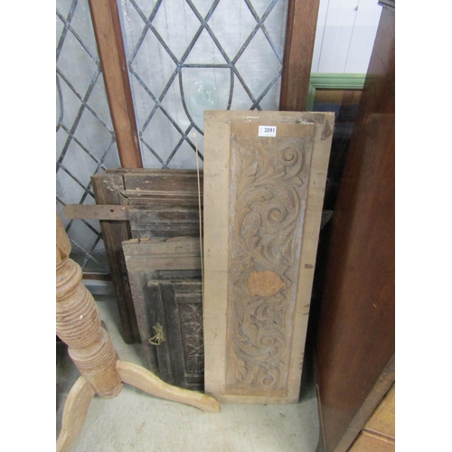 2091 - A pair of oak geometric panel doors, three carved oak panels and another