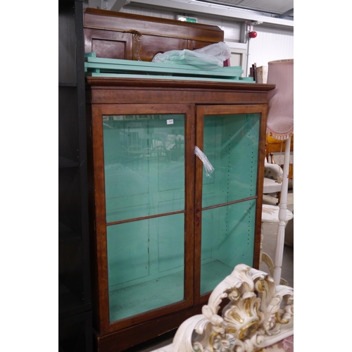 2347 - A Victorian mahogany and glazed two door cabinet