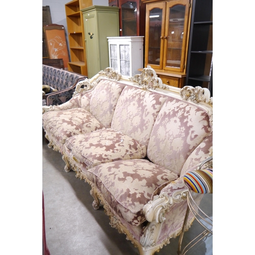 2350 - An ornately painted and gilt sofa frame for re-holstery