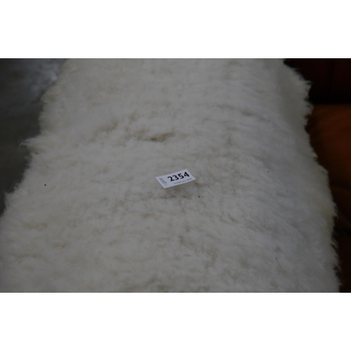 2354 - A sheep skin rug     (R) £25