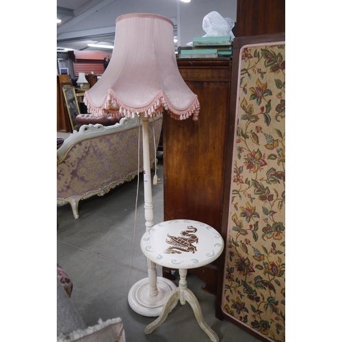 2365 - A cream standard lamp and painted occasional table (2)