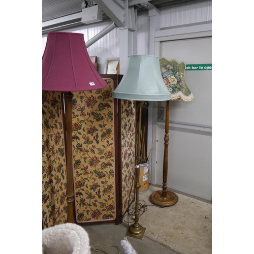 2367 - Two oak standard lamps and a brass lamp and three shades