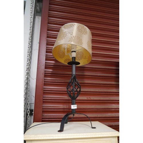 2376 - A wrought iron table lamp with shade     (E) £8-12