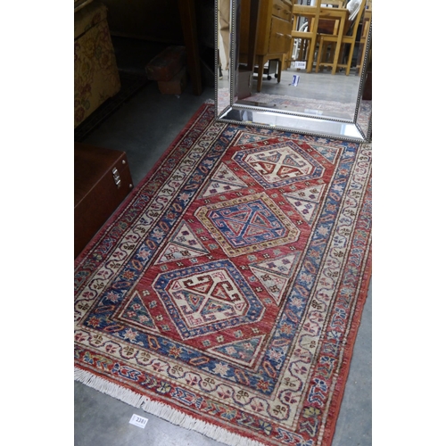 2381 - An Afghan Kazak rug 125cm x 82cm