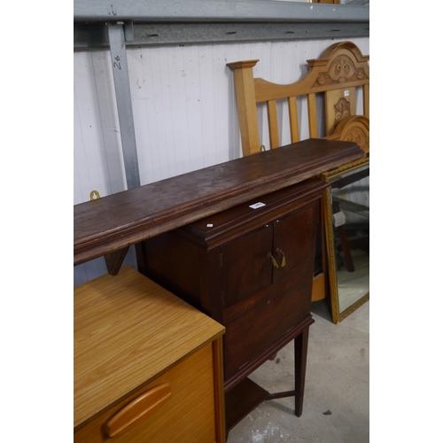 2407 - A mahogany cabinet with rising lid, twin doors and full flap, tapered legs and a kitchen shelf (2)