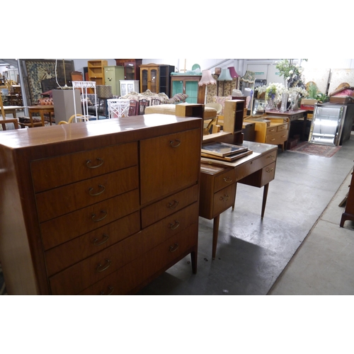 2430 - A 1960's cabinet, the front with seven drawers and single door cabinet, together with a matching dre... 