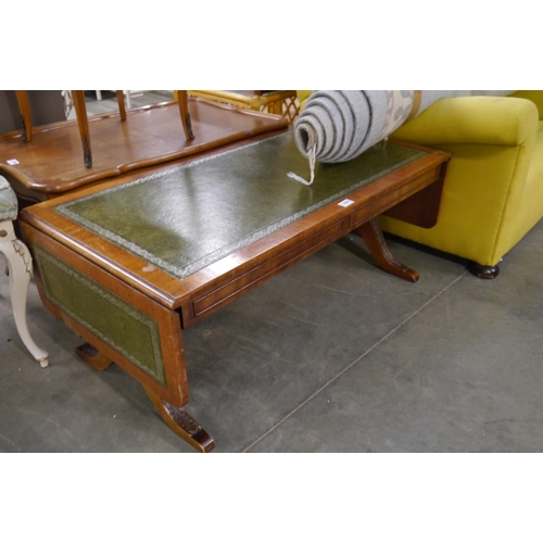 2441 - A reproduction mahogany drop leaf coffee table in the sofa table style, tooled green leather top