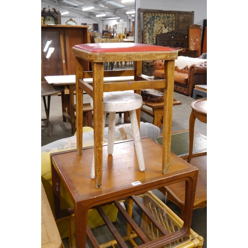 2444 - A teak coffee table and two stools