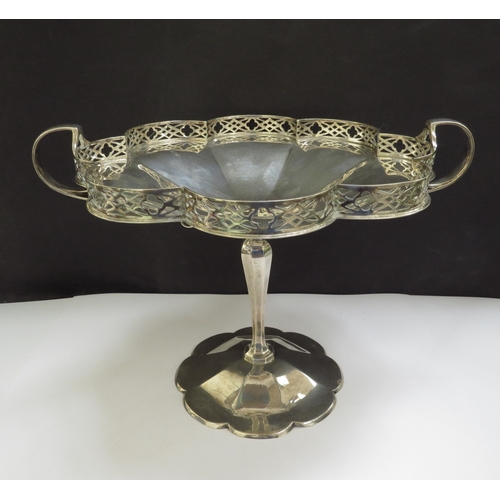 6362 - A silver tazza, the lobed dish with pierced galleried border, two handles. raised on a tapering colu... 