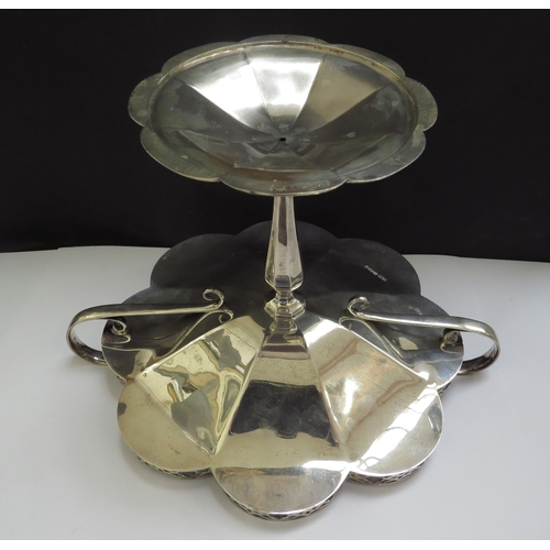 6362 - A silver tazza, the lobed dish with pierced galleried border, two handles. raised on a tapering colu... 