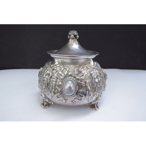 6439 - An Omar Ramsden and Alwyn Carr Arts and Crafts silver onion form inkwell with allover repousse decor... 