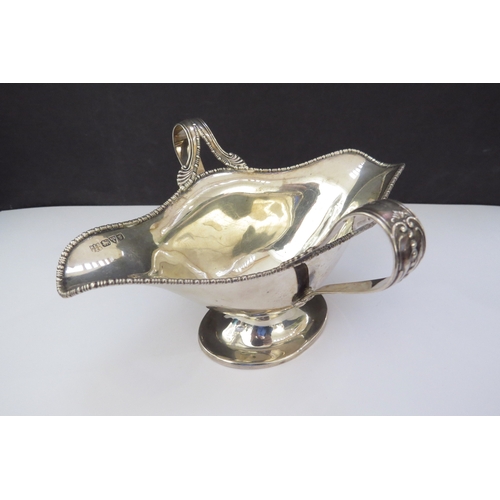 6459 - A Barker Bros silver twin handled sauce boat, beaded edge double pourer, Chester 1907, base slightly... 