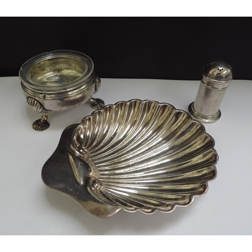 6463 - A silver shell form butter dish, London 1928, silver pepperette with glass liner, London 1921 and a ... 