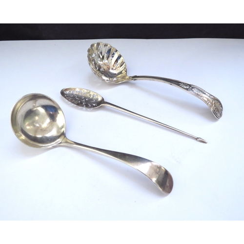 6435 - A silver sugar sifting spoon, Birmingham 1903, silver sauce ladle, Sheffield 1919 and a silver mote ... 