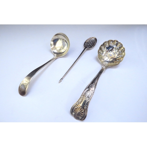 6435 - A silver sugar sifting spoon, Birmingham 1903, silver sauce ladle, Sheffield 1919 and a silver mote ... 