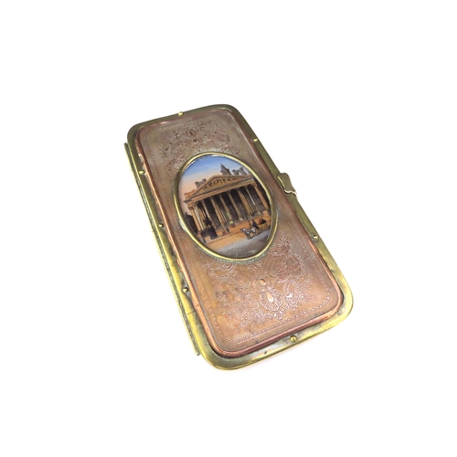 6436 - A 19th Century Grand Tour pouch/spectacle case having a brass frame with embossed copper panels to f... 