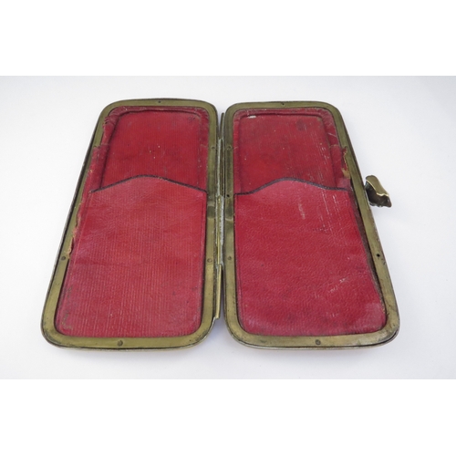 6436 - A 19th Century Grand Tour pouch/spectacle case having a brass frame with embossed copper panels to f... 