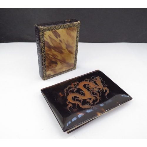 6455 - A tortoiseshell carved card case and another depicting a dragon with cream pocketed interior (2)