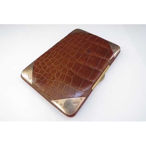 6446 - A leather crocodile skin effect wallet/card case with 9ct gold corner mounts, 13cm x 9cm