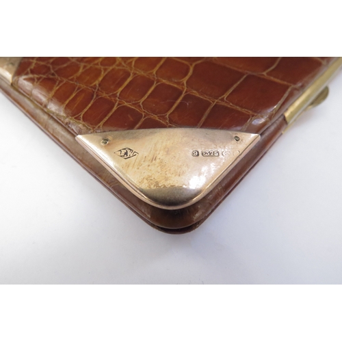 6446 - A leather crocodile skin effect wallet/card case with 9ct gold corner mounts, 13cm x 9cm