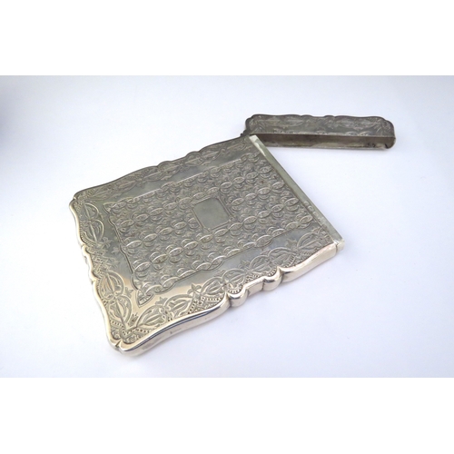 6430 - A silver card case, all over decoration vacant cartouche, Birmingham 1882, makers mark indistinct, i... 