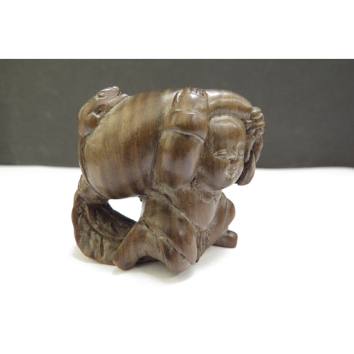 6410 - A Meiji period (1868-1912) Japanese wood Netsuke figure carrying a large root vegetable with mouse t... 