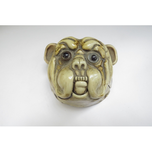 6385 - A 20th Century celluloid bulldog hotel bell, split