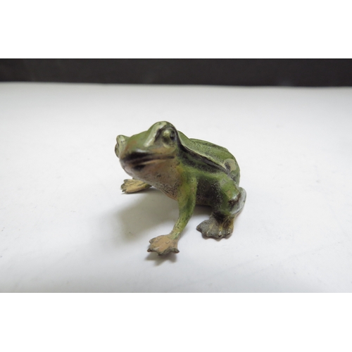 6387 - Four cold painted bronze miniature figures including chick, cat, frog and dog embracing