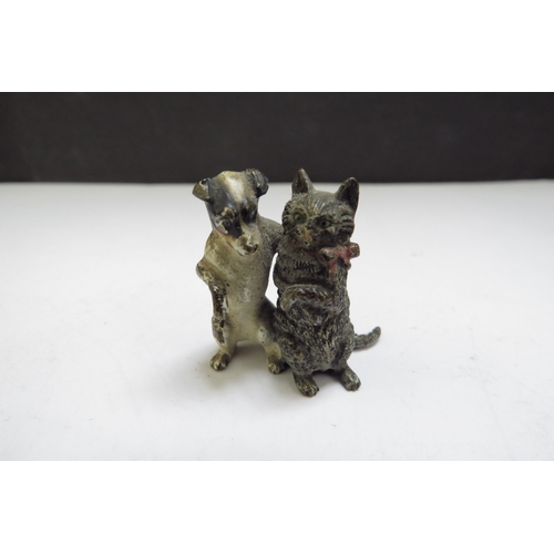 6387 - Four cold painted bronze miniature figures including chick, cat, frog and dog embracing