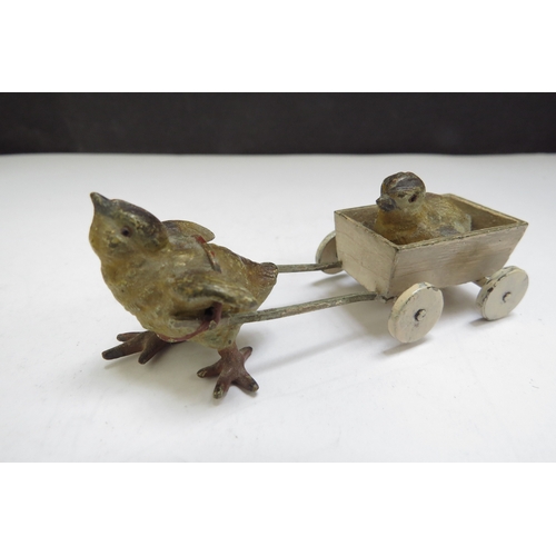 6387 - Four cold painted bronze miniature figures including chick, cat, frog and dog embracing