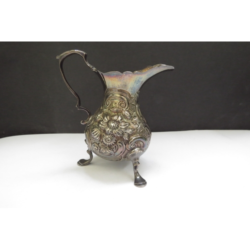 6396 - A Thomas Smith silver creamer, floral and foliate scrolled relief, raised on pad feet, London 1791, ... 